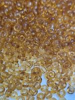 Бисер круглый прозрачный. Размер 10/0, 2,3 мм. Цвет светло коричневый. Номер 2. Производство Китай.
